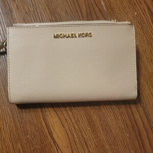 MK Michael Kors light pink wristlet wallet with card slots